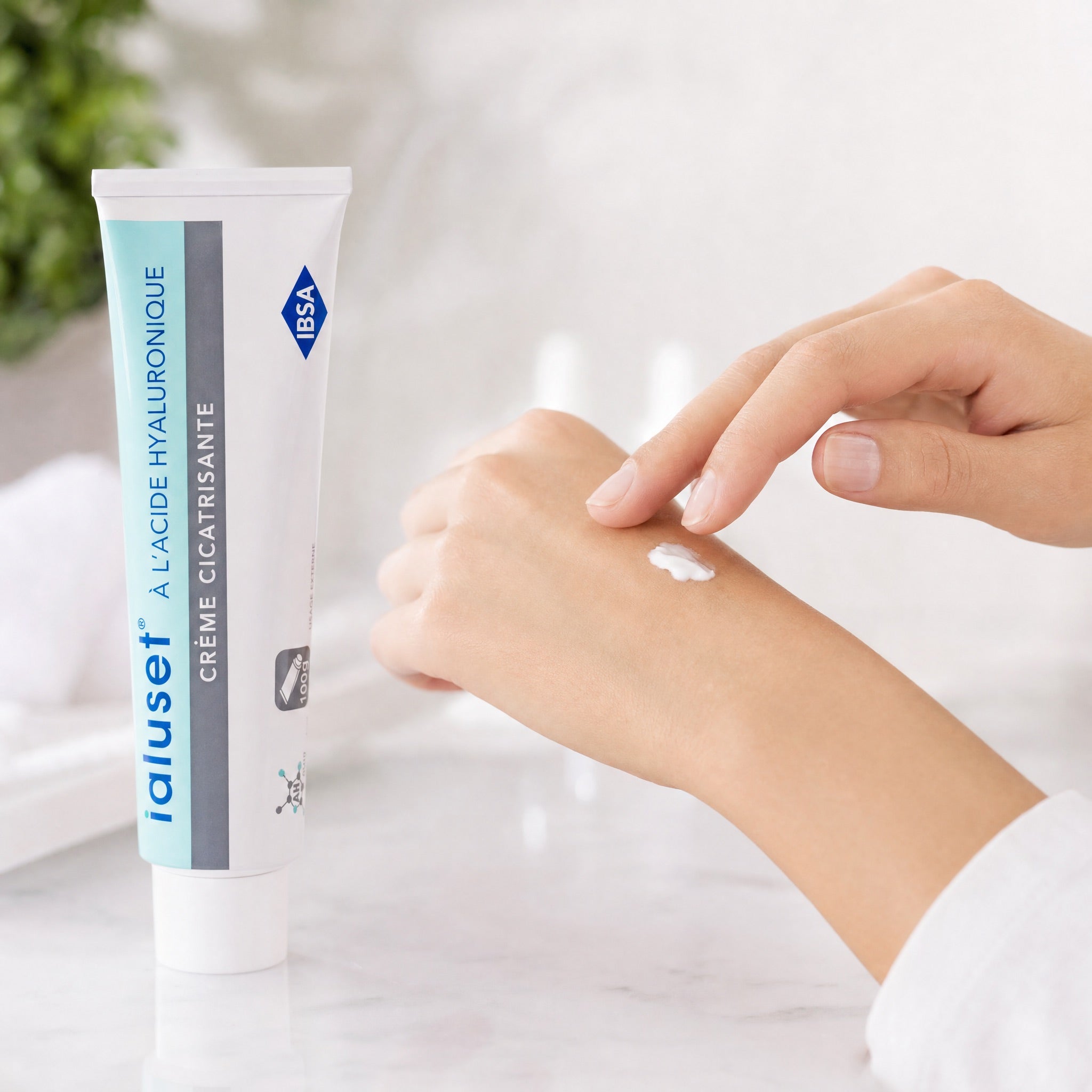 Applying Ialuset Hyaluronic Acid Healing Cream 100g showing smooth moisturizing cream texture